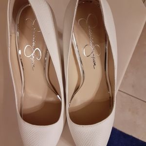 White pumps worn twice